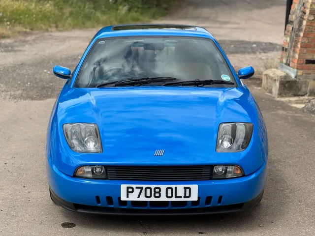 A blue Fiat Coupe 20v Turbo, front on