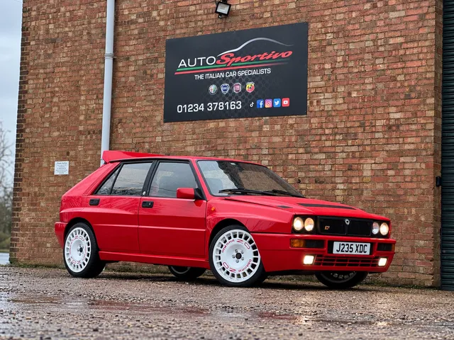 A red Lancia Delta Integrale outside the Auto Sportivo unit